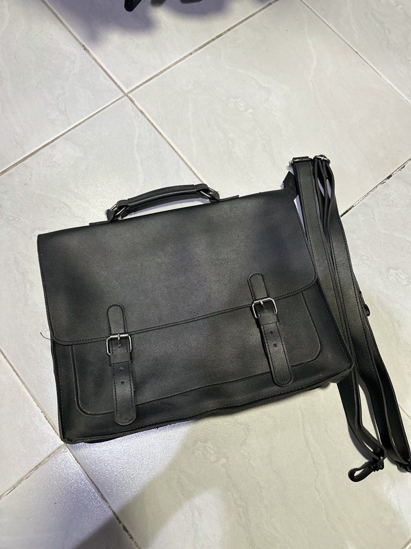 Black Leather Satchel Briefcase Convertible Backpack (Category: Sling Bags) located in Makati City. Submitted by its.ptrck (Listing ID 1468115979, Image 1). Description: - Style: (converts from messenger to backpack) - Closure: Flap with hidden magnetic snaps under decorative dual buckles - Comfort & Carry: Top handle and adjustable shoulder straps with rear D-rings - Storage: Convenient front slip pocket under the main flap - Versatility: Perfec