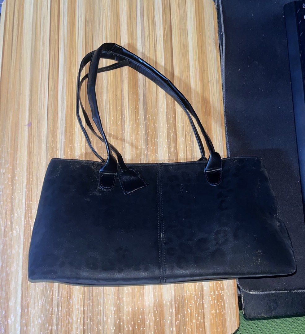 Black Leopard Print Tote Bag with Shoulder Straps (Category: Tote Bags) located in Naic. Submitted by nasaryn_ (Listing ID 1468192551, Image 1). Description: - Color & Pattern: Sleek black with a subtle, trendy leopard print - Storage: Spacious interior lined in grey, easily fits textbooks, an umbrella, and daily essentials - Closure: Secure magnetic clasp closure - Straps: Two sturdy top shoulder straps for comfortable carrying - Design: Clean e
