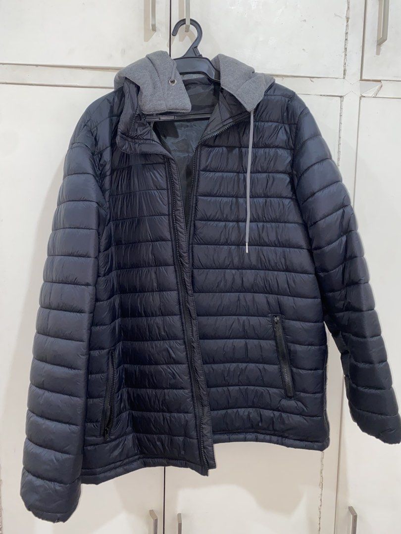 Black Puffer Jacket with Grey Hood (Category: Coats, Jackets and Outerwear) located in Manila. Submitted by pems25 (Listing ID 1468102019, Image 1). Description: - Color: Black with contrast grey hoodie - Closure: Full front zip - Pockets: Secure zippered side pockets - Design: Quilted body and sleeves with adjustable grey drawstrings - Warmth: Padded build, ideal for cold weather.