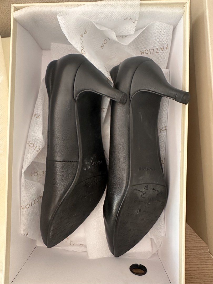 Black shoes (Category: Heels) located in Paranaque City. Submitted by all_about_selling (Listing ID 1468063716, Image 3). Description: Brand: Pazzion (Singapore brand) Size: 38 Color: Black Material: Calf Leather Heels height: 1.5 inches Flaw: with small dent in the heel. See photo Complete set with box Bought for 5k plus in Rustans. Selling low because Im no longer go to office .