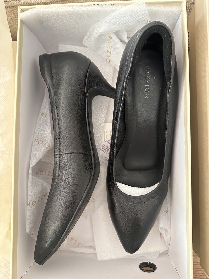 Black shoes (Category: Heels) located in Paranaque City. Submitted by all_about_selling (Listing ID 1468063716, Image 1). Description: Brand: Pazzion (Singapore brand) Size: 38 Color: Black Material: Calf Leather Heels height: 1.5 inches Flaw: with small dent in the heel. See photo Complete set with box Bought for 5k plus in Rustans. Selling low because Im no longer go to office .