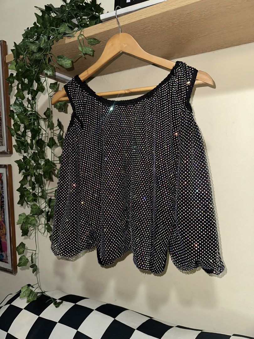 Black sparkly rhinestone sleeveless top (Category: Sleeveless) located in Manila. Submitted by tenshiii185 (Listing ID 1468089019, Image 1). Description: Super sparkly black sleeveless top covered in rainbow rhinestones. Features a scoop neckline and loose fit. Perfect statement piece for nights out, parties, and easily pairs with jeans or skirts. ❗️Issue: first layer may butas pero hindi halata..