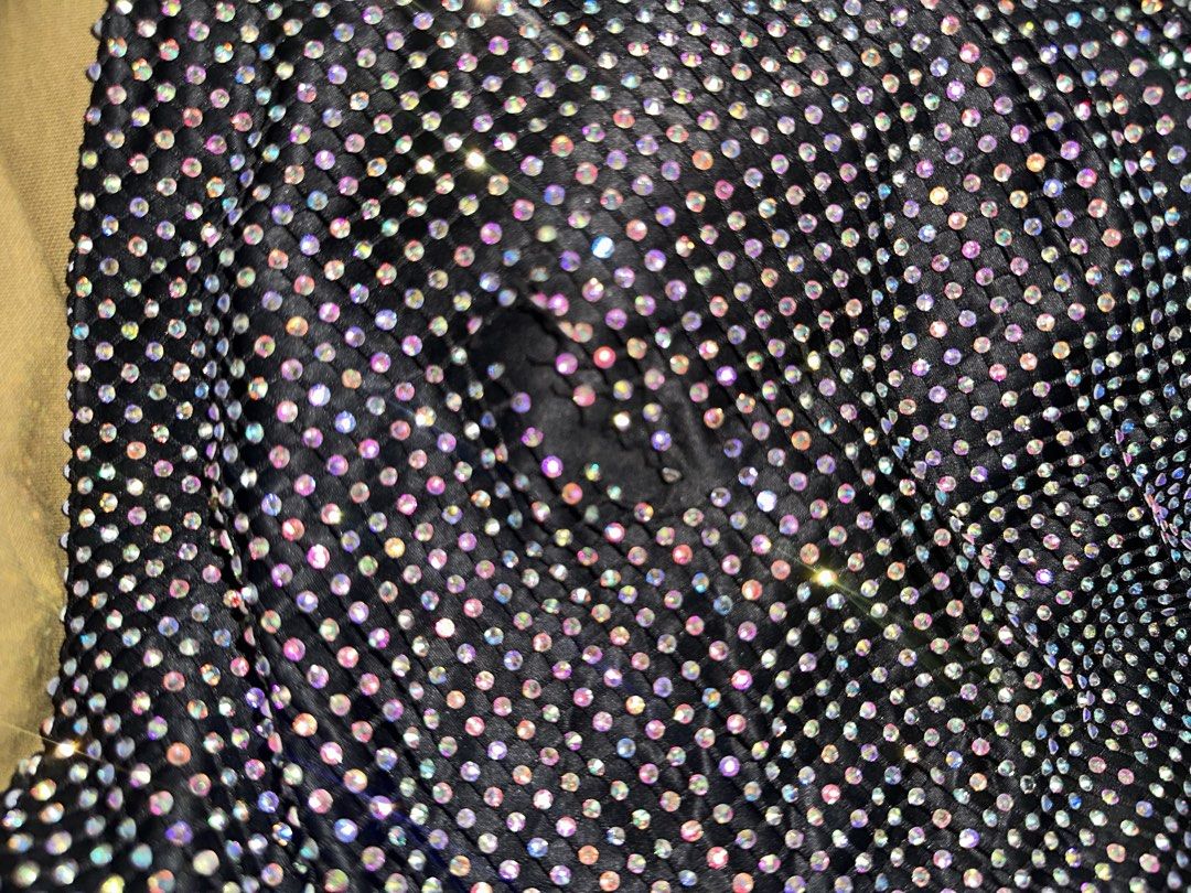 Black sparkly rhinestone sleeveless top (Category: Sleeveless) located in Manila. Submitted by tenshiii185 (Listing ID 1468089019, Image 2). Description: Super sparkly black sleeveless top covered in rainbow rhinestones. Features a scoop neckline and loose fit. Perfect statement piece for nights out, parties, and easily pairs with jeans or skirts. ❗️Issue: first layer may butas pero hindi halata..