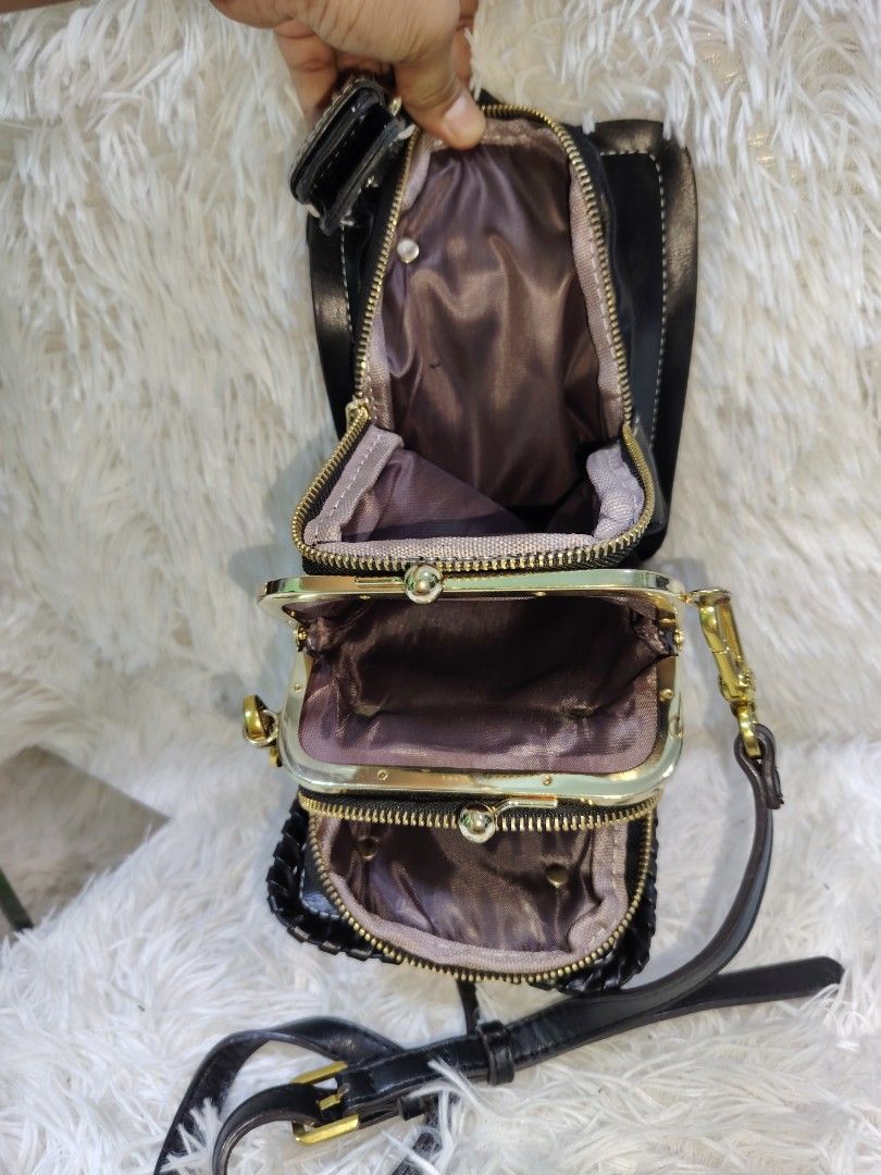 Black Studded Multi-Compartment Crossbody Bag with Gold Hardware (Category: Cross-body Bags) located in Quezon City. Submitted by zhelcloset01 (Listing ID 1468197630, Image 3). Description: Black faux leather crossbody bag with gold-tone hardware and stud details along the front flap and edges. Includes a decorative buckle strap closure and an adjustable shoulder strap. Interior features multiple zippered compartments and a kiss-lock kiss lock mi