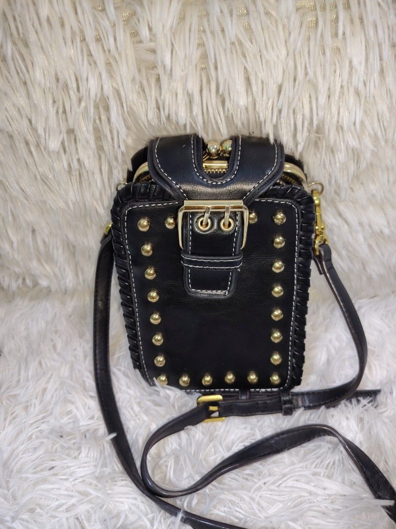 Black Studded Multi-Compartment Crossbody Bag with Gold Hardware (Category: Cross-body Bags) located in Quezon City. Submitted by zhelcloset01 (Listing ID 1468197630, Image 1). Description: Black faux leather crossbody bag with gold-tone hardware and stud details along the front flap and edges. Includes a decorative buckle strap closure and an adjustable shoulder strap. Interior features multiple zippered compartments and a kiss-lock kiss lock mi