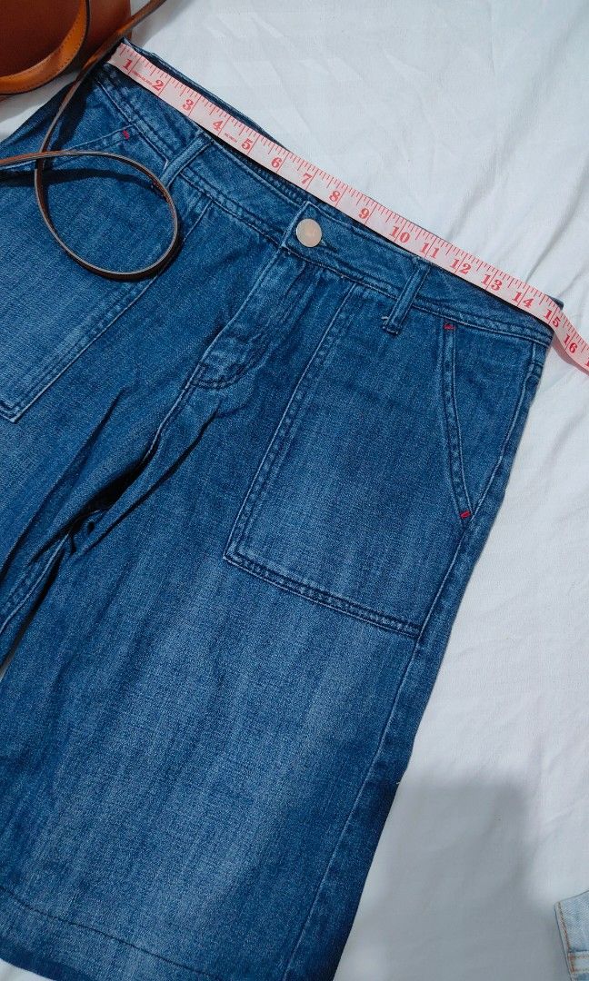 Blue Denim Shorts with Front Pockets (Category: Shorts) located in Bacolor. Submitted by annjjjjj (Listing ID 1468081946, Image 3). Description: - Style: High-waisted denim shorts - Wash: Medium wash - Details: Large front patch pockets, button closure, belt loops - Accent: Unique red stitching near pockets - Fit & Use: Comfortable for everyday wear and easy to pair with tees or tanks.