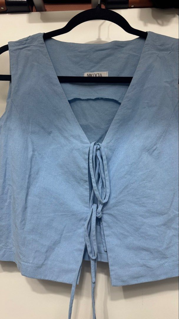 Blue Linen Ribbon Tie Front (Category: Sleeveless) located in Mandaluyong City. Submitted by _rizaespiritu (Listing ID 1468098962, Image 2). Description: - bought it from the blue app - used twice only.