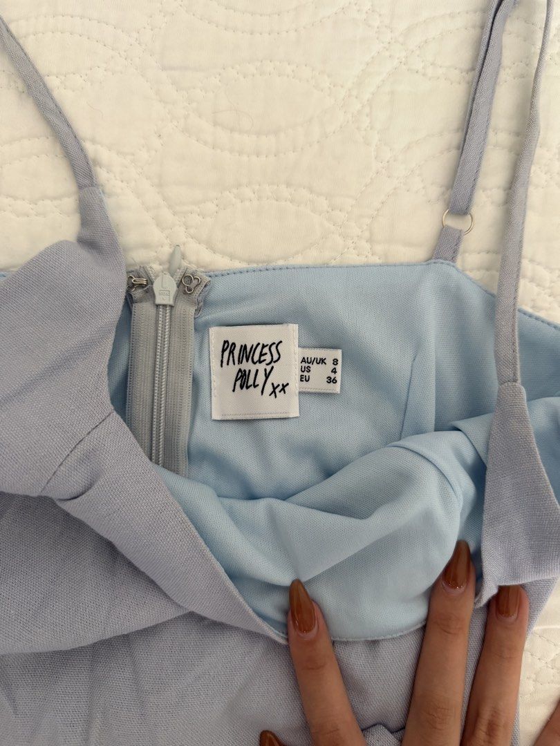 Blue Princess Polly Wrap Dress (Category: Dresses) located in Quezon City. Submitted by kelangot (Listing ID 1468123290, Image 3). Description: Selling this item in great condition! Brand: princess polly Size: US 4 Condition: worn twice or thrice Color: baby blue RFS: decluttering 📦 Shipping: C/O buyer 💸 Payment: GCash, BPI, or GoTyme Feel free to message me for inquiries Strictly no cancellations, returns, or refunds. Happy shopping! ♡.