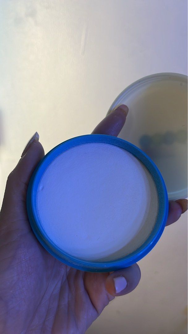 Blue Round Compact Face Powder Container (Category: Makeup) located in Manila. Submitted by goddesssy (Listing ID 1468183710, Image 2). Description: - Product: Compact Face Powder - Color: White powder in a round case with a stylish blue rim - Condition: Barely touched, smooth surface - Size: Handy and travel-friendly for easy on-the-go touch-ups - Use: Everyday makeup essential.