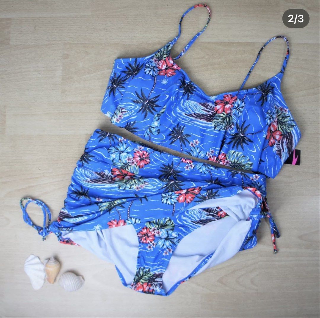 Blue Tropical Print High Waisted Bikini Set (Category: Bikinis & Swimsuits) located in Bulacan. Submitted by peach1025 (Listing ID 1468067192, Image 2). Description: - Brand new with tags (BNWT) blue tropical palm tree and floral print two-piece swimsuit - High-waisted bottoms feature adjustable drawstring sides for a customized fit - Matching top includes thin shoulder straps, secure back clasp closure, and removable padding - Material: 85% poly