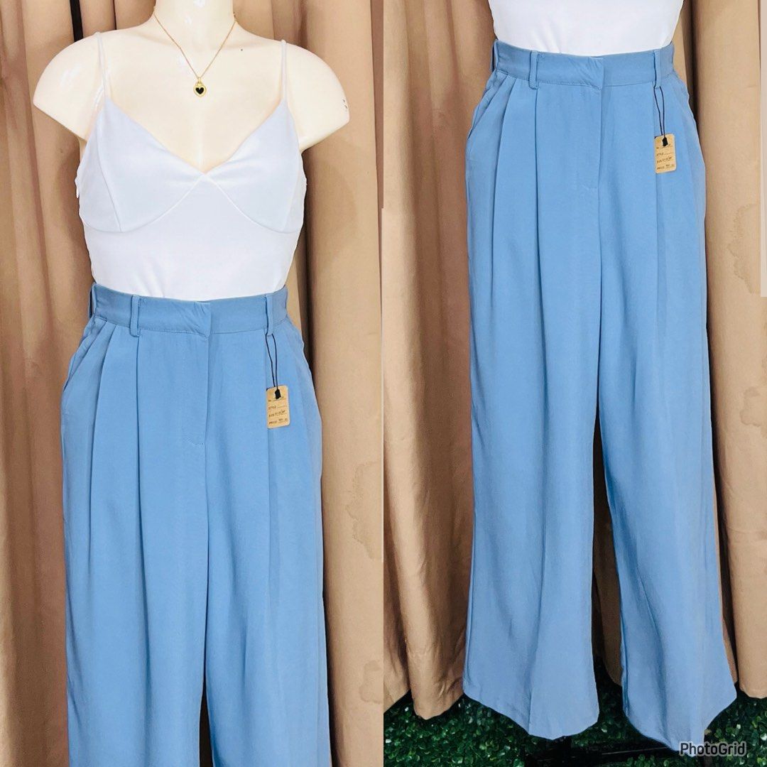 Blue Wide Leg Pleated Trousers (Category: Other Bottoms) located in Manila. Submitted by bengirlclothing (Listing ID 1468141199, Image 2). Description: -SIZE: 22-28 inches -LENGTH: 39 inches - Color: Light blue - Style: High-waisted trousers with front pleats and side pockets - Fit: Relaxed wide leg.