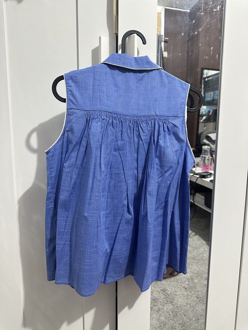 Bonpoint Blue Checked Sleeveless Blouse Size 14A (Category: Sleeveless) located in Manila. Submitted by bananakwon (Listing ID 1468087462, Image 3). Description: Brand: Bonpoint Design: Blue and white micro-checked sleeveless blouse with collared neckline Details: Button-up front with white buttons and stylish pleated flare from the chest Size: 14A (fits older kids or teens, originally dress talaga siya for kids pero it can be use as a top) Origi