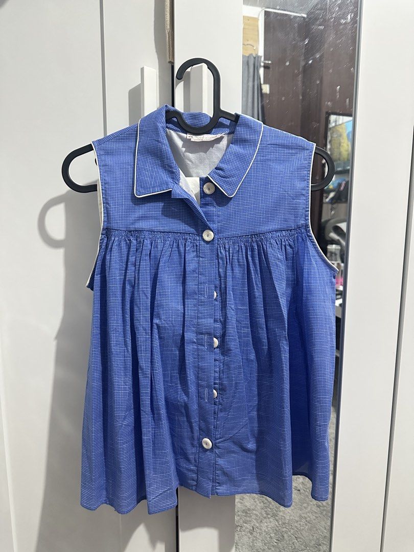 Bonpoint Blue Checked Sleeveless Blouse Size 14A (Category: Sleeveless) located in Manila. Submitted by bananakwon (Listing ID 1468087462, Image 1). Description: Brand: Bonpoint Design: Blue and white micro-checked sleeveless blouse with collared neckline Details: Button-up front with white buttons and stylish pleated flare from the chest Size: 14A (fits older kids or teens, originally dress talaga siya for kids pero it can be use as a top) Origi