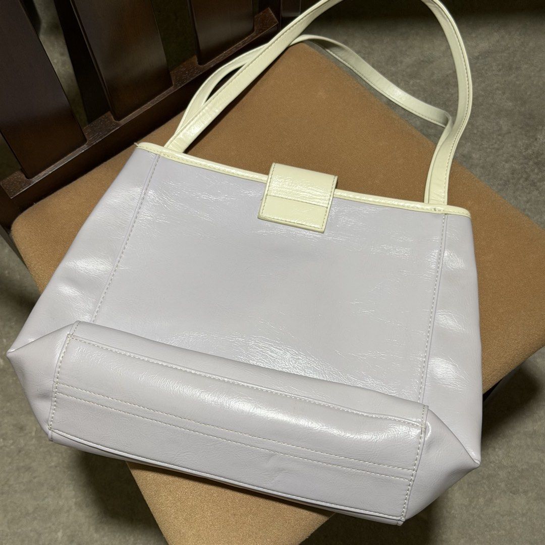 Bostanten Tote Bag Pastel Multi (Category: Tote Bags) located in Caloocan City. Submitted by catwonrideul (Listing ID 1468142503, Image 3). Description: - Brand: Bostanten - Color: Pastel purple, pink, and cream with contrast trim - Design: Front pocket with stylish buckle accent and double shoulder straps - Interior: Clean grey fabric lining with a convenient slip pocket - Condition: Excellent, clean both inside and out - Original Price: ₱689.