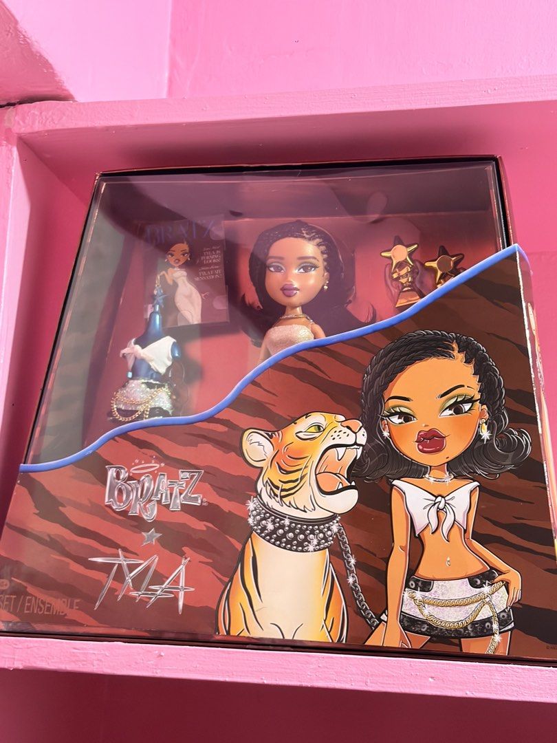 Bratz Tyla Collector Edition Doll Box (Category: Kids Toys) located in Caloocan City. Submitted by mgabbisaniel (Listing ID 1468229479, Image 1). Description: - Limited Collector Edition Bratz x Tyla collaboration doll - Brand new in original, unopened display box in pristine condition - Features eye-catching tiger graphic artwork and sculpted fashion pieces - Highly detailed braids and flawless face makeup - Includes exclusive mini magazine and 