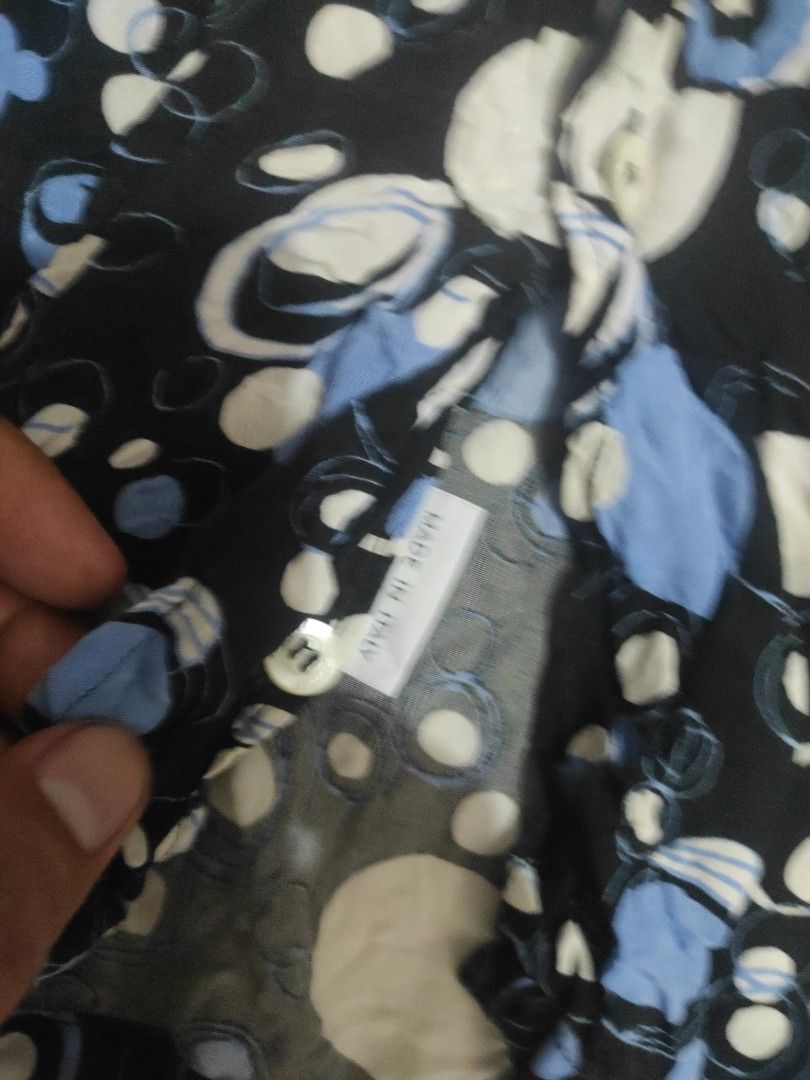 Brioni Patterned Shirt (Category: Formal Shirts) located in Santa Rosa. Submitted by y2kstylist (Listing ID 1468125281, Image 3). Description: - Brand: Brioni for Neiman Marcus - Origin: Made in Italy - Design: Black base with abstract white and blue circle pattern - Details: Classic collar and genuine mother-of-pearl buttons - Material: Lightweight cotton - Condition: Great summer statement piece for casual outings W22 L29.