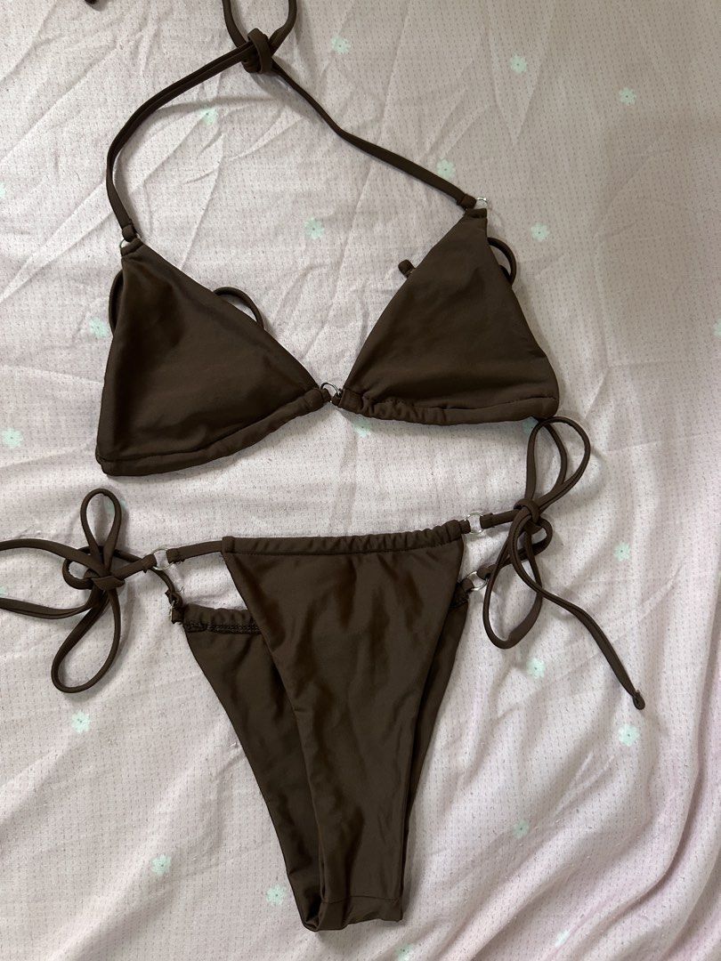 Brown Bikini Set with O-Ring Details (Category: Bikinis & Swimsuits) located in Lipa City. Submitted by chiechums (Listing ID 1468106474, Image 1). Description: - Color: Gorgeous chocolate brown - Style: Two-piece triangle halter top and low-rise bottoms with side-tie strings - Details: Chic metal ring hardware connecting straps and sides - Fit: Fully adjustable via string design for a custom fit - Material: Soft, stretchy, and comfortable swim f