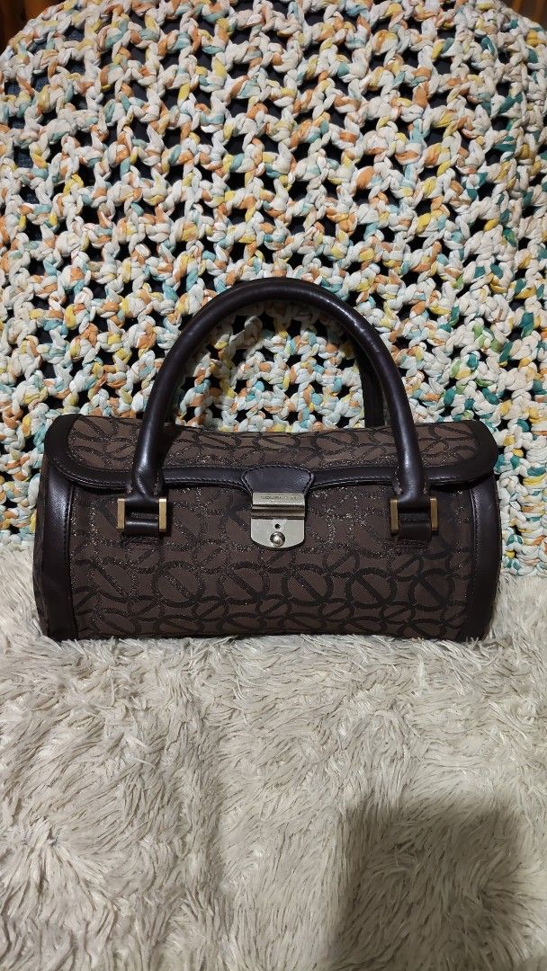Brown Patterned Barrel Handbag with Leather Handles (Category: Shoulder Bags) located in Cebu City. Submitted by lumaynojes00490 (Listing ID 1468071163, Image 2). Description: good condition handbag.