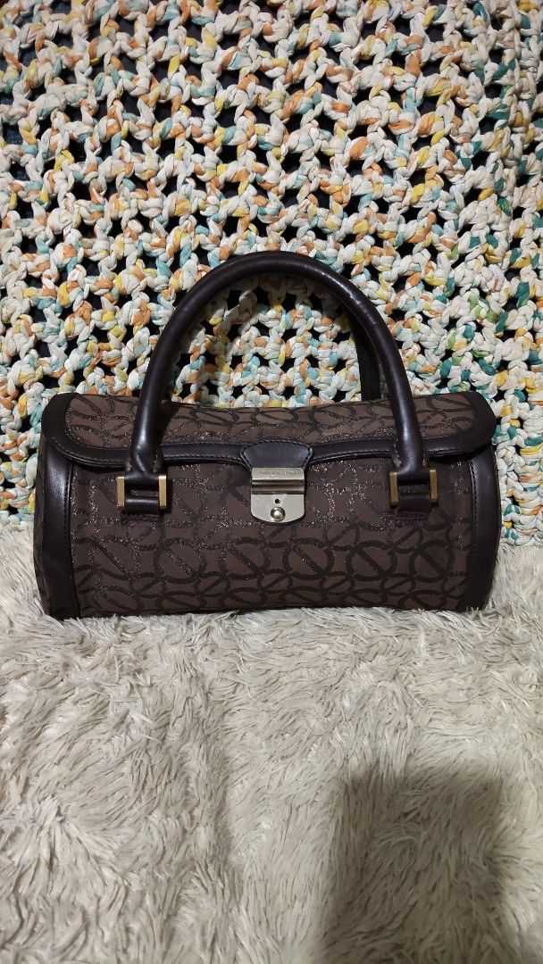 Brown Patterned Barrel Handbag with Leather Handles (Category: Shoulder Bags) located in Cebu City. Submitted by lumaynojes00490 (Listing ID 1468071163, Image 1). Description: good condition handbag.