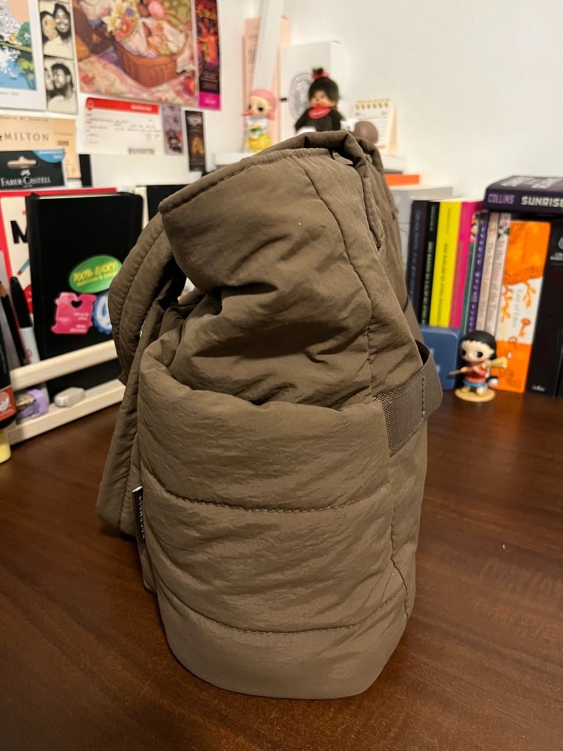 Brown Puffer Zip Tote Bag - Bagsmart (Medium) (Category: Tote Bags) located in Mabalacat. Submitted by applebottomjaens (Listing ID 1468102425, Image 3). Description: - Color: Dark chocolate brown - Size: Medium - Material: Soft quilted padded fabric - Closure: Secure top zip - Interior: Lined with multiple slip pockets and a divider section, can comfortably fit a 13-inch laptop inside the laptop compartment - Storage: Spacious front compartment 