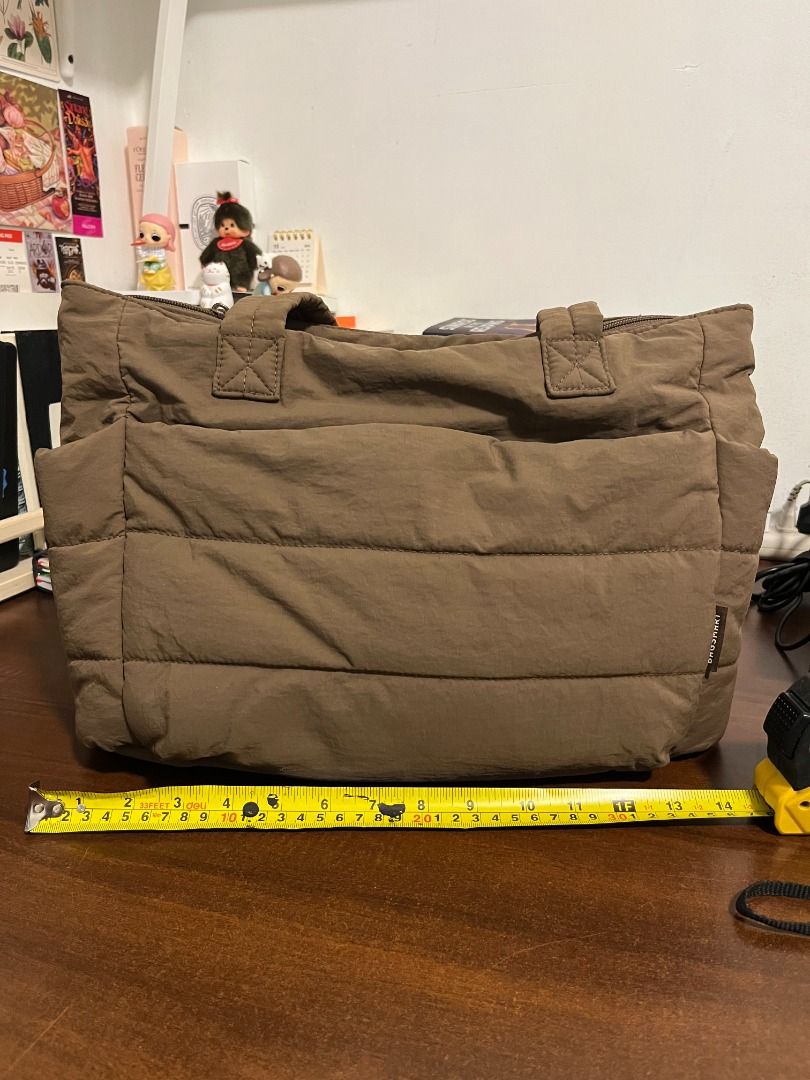 Brown Puffer Zip Tote Bag - Bagsmart (Medium) (Category: Tote Bags) located in Mabalacat. Submitted by applebottomjaens (Listing ID 1468102425, Image 2). Description: - Color: Dark chocolate brown - Size: Medium - Material: Soft quilted padded fabric - Closure: Secure top zip - Interior: Lined with multiple slip pockets and a divider section, can comfortably fit a 13-inch laptop inside the laptop compartment - Storage: Spacious front compartment 