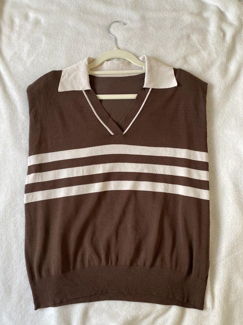 Brown Striped V-Neck Collared Knit Sweater Vest (Category: Sleeveless) located in Cavite. Submitted by jaydaascollection (Listing ID 1468075309, Image 1). Description: - Color: Brown with cream horizontal stripes - Style: Sleeveless V-neck sweater vest with contrast collar and ribbed hem - Material: Lightweight knit - Fit: Easy to layer over button-downs or wear on its own - Aesthetic: Vintage, retro-chic.