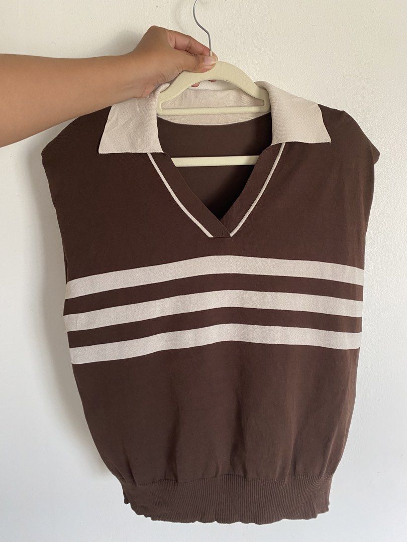Brown Striped V-Neck Collared Knit Sweater Vest (Category: Sleeveless) located in Cavite. Submitted by jaydaascollection (Listing ID 1468075309, Image 2). Description: - Color: Brown with cream horizontal stripes - Style: Sleeveless V-neck sweater vest with contrast collar and ribbed hem - Material: Lightweight knit - Fit: Easy to layer over button-downs or wear on its own - Aesthetic: Vintage, retro-chic.