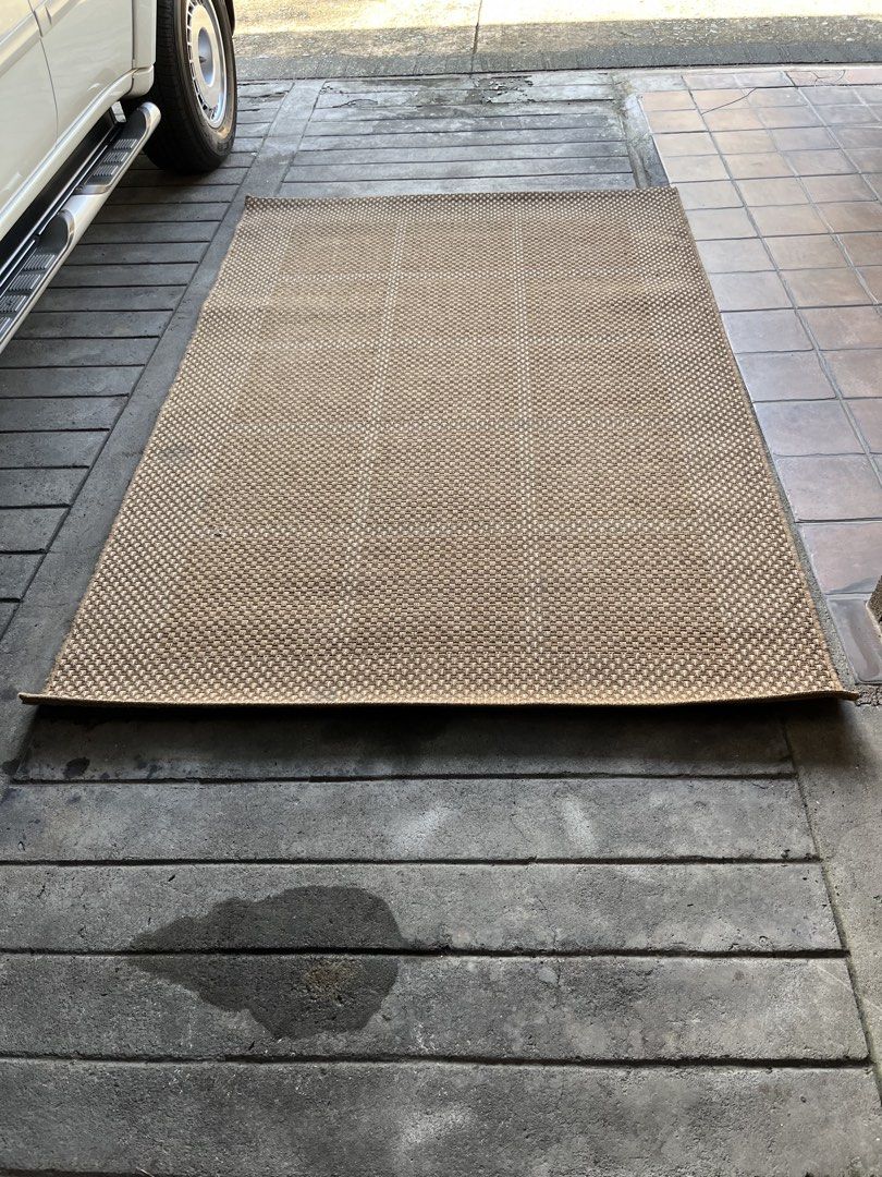 Brown Woven Area Rug (Category: Carpets, Mats & Flooring) located in Quezon. Submitted by vintage66 (Listing ID 1468097881, Image 1). Description: - Large woven area rug in a versatile brown neutral earth tone - Stylish textured basketweave pattern with neat finished borders - Flat weave construction allows for easy vacuuming and low maintenance - Perfect accent for hardwood or tile floors - Suitable for indoor spaces like living rooms and bedroo