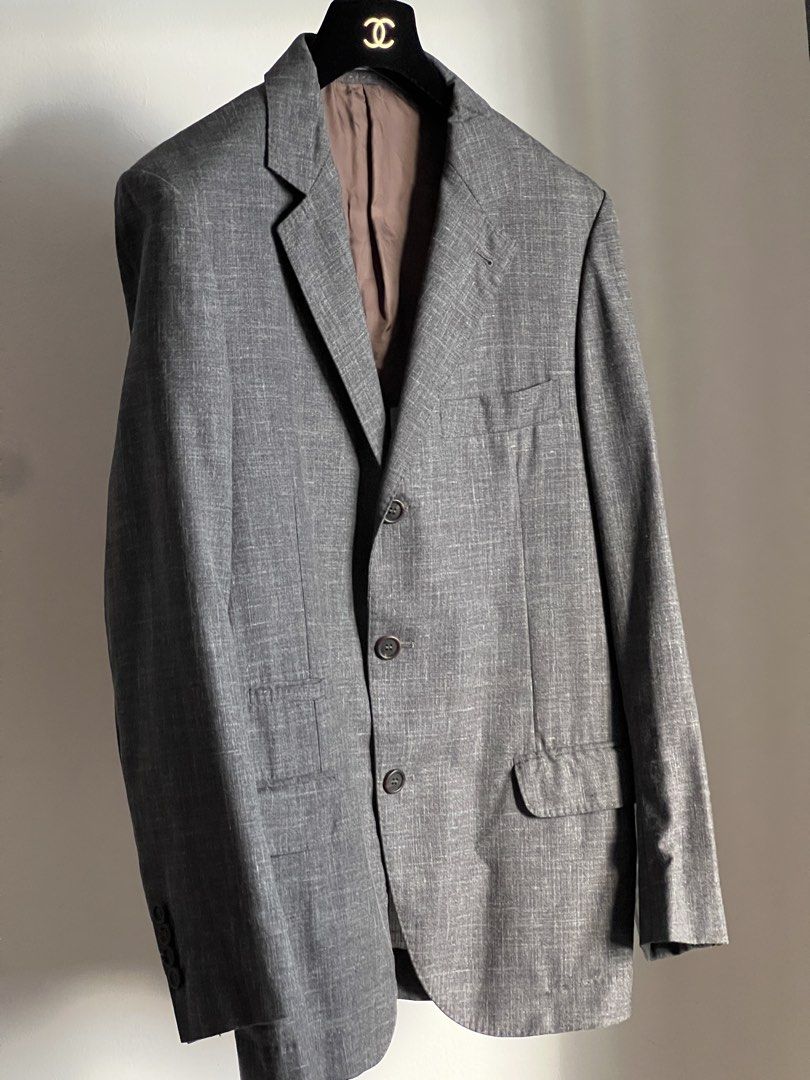 Brunello Cucinelli buggy-lined jacket (Category: Luxury Apparel) located in Quezon City. Submitted by raccoonfur (Listing ID 1468075585, Image 1). Description: Brunello Cucinelli summer wool blend unlined blazer. Interesting texture with artisanal pick stitching all around. Ideal for warmer climates. Lightweight with the roundedness of a true tailored garment. Great condition. Comes with garment bag. Flat measurements: Pit to pit 48.25cm/19in Wai