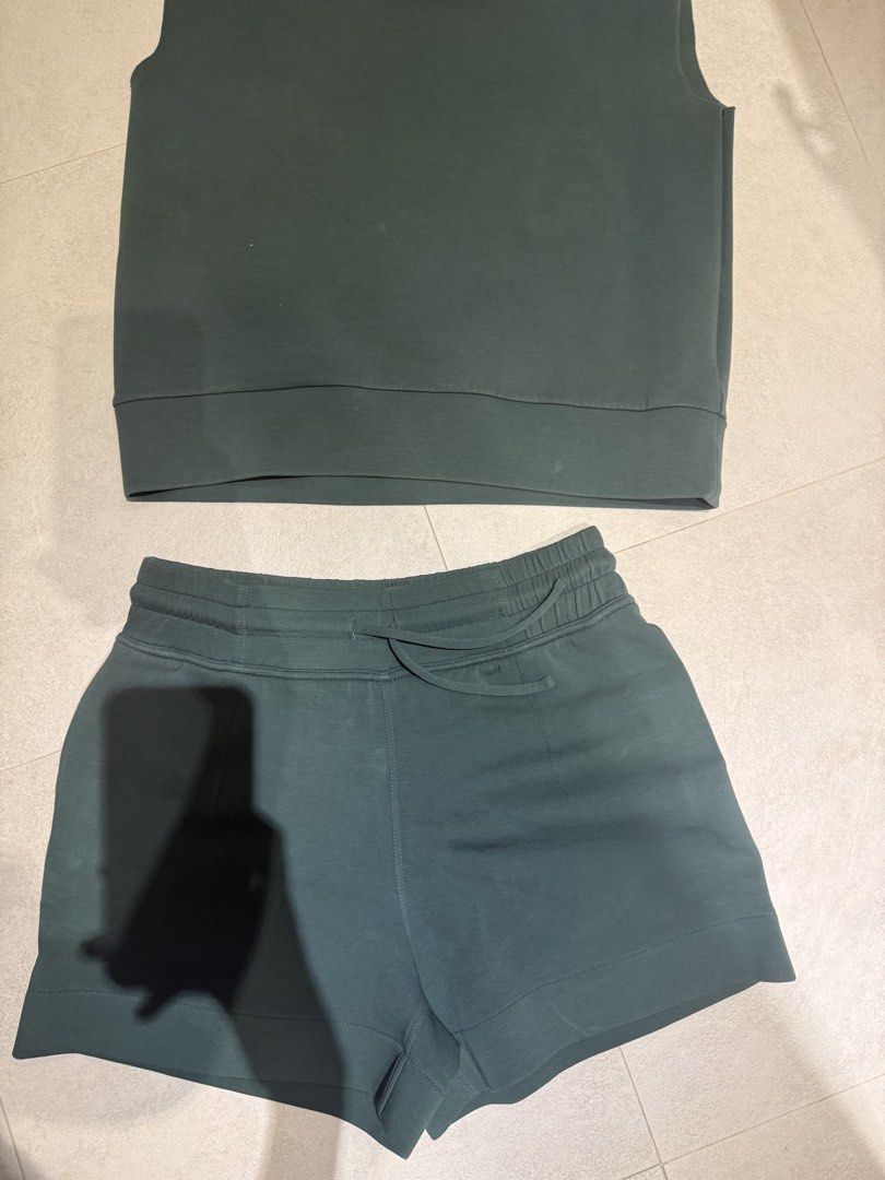 BUNDLE Mosaic Sleeveless Turtleneck Top And Shorts Set (Category: Sets or Coordinates) located in Makati City. Submitted by rockandraw (Listing ID 1468085409, Image 3). Description: - Brand: Mosaic - Size: M - Colors available: Dark green, white - Set includes: Sleeveless top with folded high collar and matching drawstring shorts - Material: Soft fabric with structure - Versatile: Wear as a complete set or mix and match with wardrobe basics.