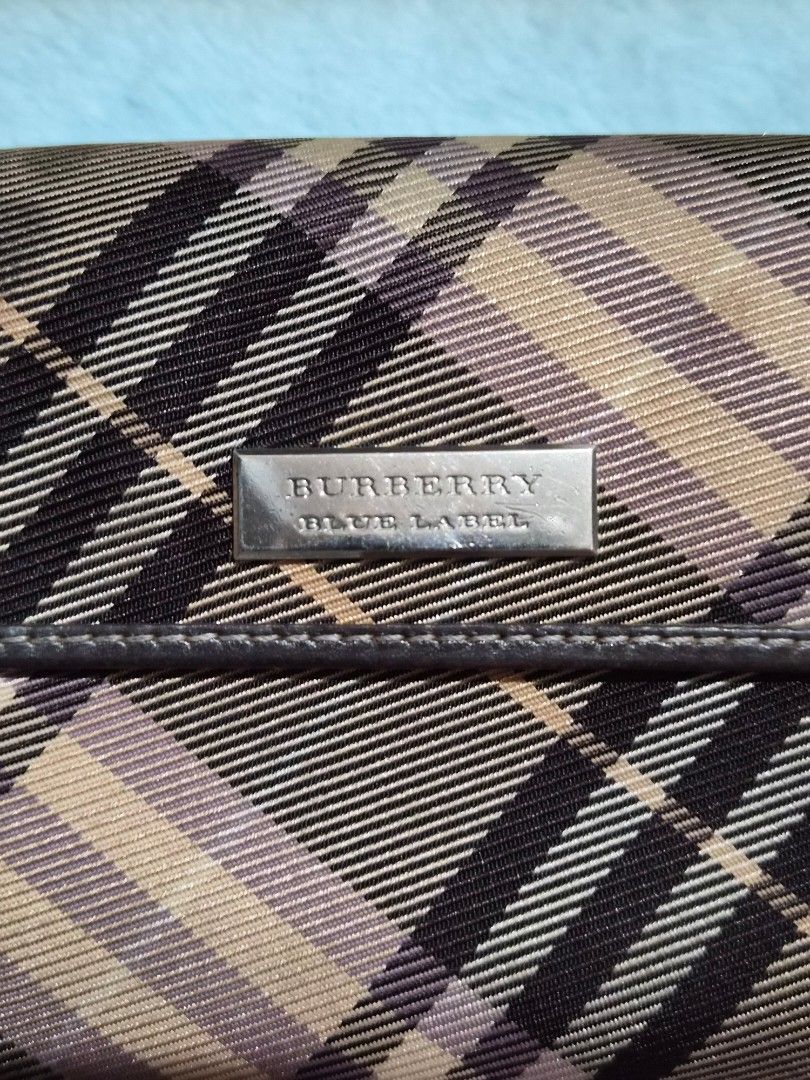 Burberry Blue Label Plaid Wallet (Category: Baby Monitors) located in Mandaue City. Submitted by chuchi152615 (Listing ID 1468149488, Image 2). Description: - Authentic Burberry Blue Label tri-fold wallet - Iconic beige check pattern with premium brown leather trim - Secure snap button closure to keep your essentials safe - Features a chic engraved metal Burberry Blue Label plaque on the front - Compact design with ample card slots and cash compa
