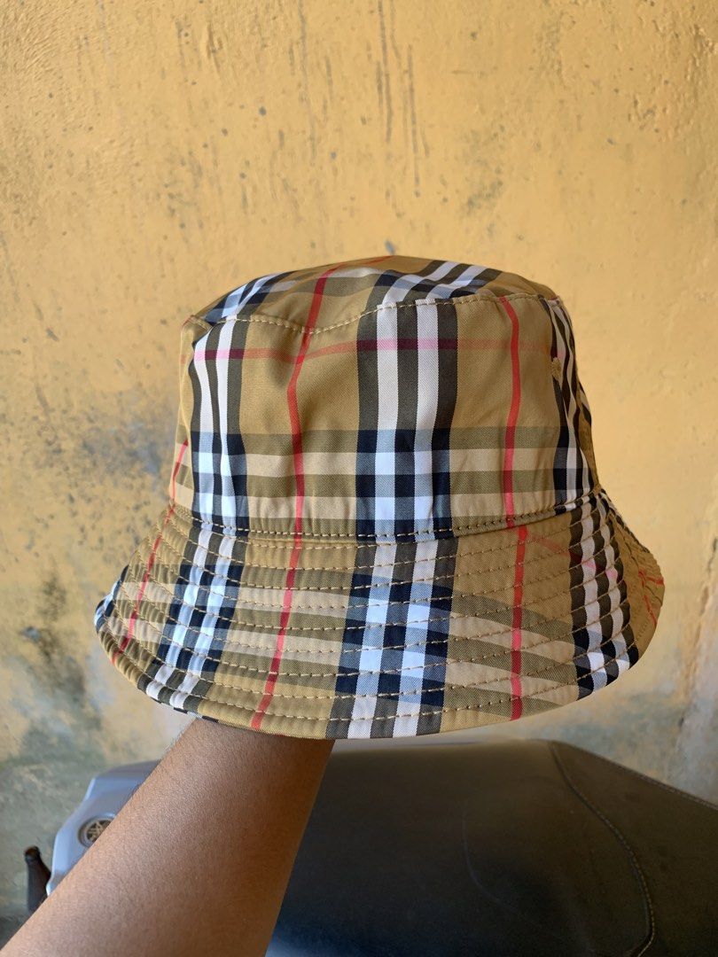 Burberry Check Bucket Hat (Category: Luxury Apparel) located in Dagupan City. Submitted by re.worth.dgpn.ph (Listing ID 1468109049, Image 2). Description: - Brand: Burberry - Pattern: Classic Archive Beige Check - Origin: Made in Italy - Material: 100% hemp outer, black inner lining - Condition: Clean fabric with tags intact inside - Fit: Standard fit - Style: Casual headwear, great for sunny days or streetwear.