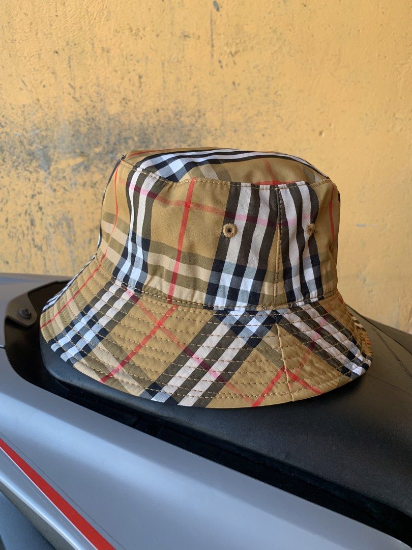 Burberry Check Bucket Hat (Category: Luxury Apparel) located in Dagupan City. Submitted by re.worth.dgpn.ph (Listing ID 1468109049, Image 1). Description: - Brand: Burberry - Pattern: Classic Archive Beige Check - Origin: Made in Italy - Material: 100% hemp outer, black inner lining - Condition: Clean fabric with tags intact inside - Fit: Standard fit - Style: Casual headwear, great for sunny days or streetwear.