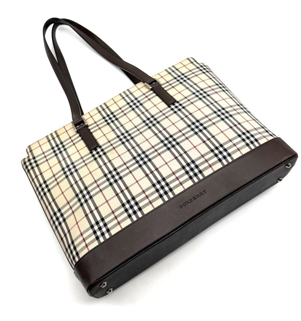 Burberry Check Tote Bag Brown (Category: Luxury Bags & Wallets) located in Quezon City. Submitted by surplus.hunter (Listing ID 1468144187, Image 3). Description: - Authentic Burberry tote bag in classic check pattern - Premium brown leather trim and sturdy handles - Secure zip top closure to keep your belongings safe - Structured rectangular base with protective metal feet - Spacious interior perfect for daily essentials - Signature branding on 