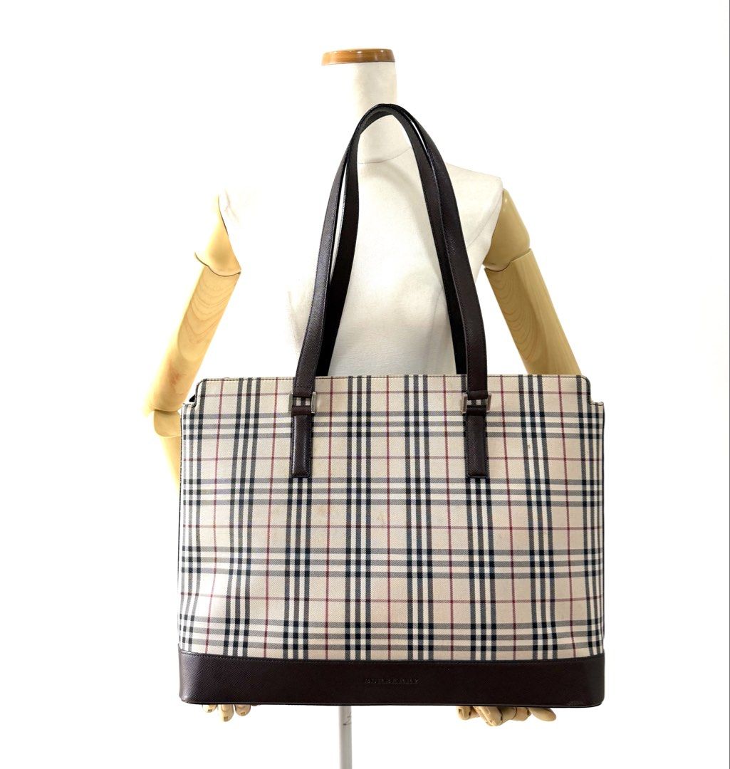 Burberry Check Tote Bag Brown (Category: Luxury Bags & Wallets) located in Quezon City. Submitted by surplus.hunter (Listing ID 1468144187, Image 1). Description: - Authentic Burberry tote bag in classic check pattern - Premium brown leather trim and sturdy handles - Secure zip top closure to keep your belongings safe - Structured rectangular base with protective metal feet - Spacious interior perfect for daily essentials - Signature branding on 