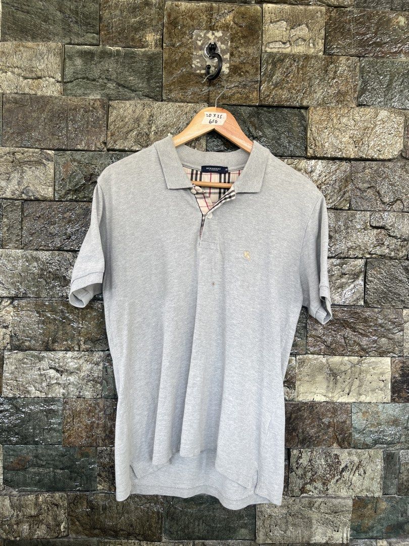 Burberry Gray Poloshirt (Category: Tshirts & Polo Shirts ) located in Cagayan de Oro. Submitted by curatedheirloomph_ (Listing ID 1468230963, Image 1). Description: 𝘿𝙞𝙢𝙚𝙣𝙨𝙞𝙤𝙣𝙨: 20x25 𝘽𝙚𝙨𝙩 𝙁𝙞𝙩: Small - Medium 𝘾𝙤𝙣𝙙𝙞𝙩𝙞𝙤𝙣 & 𝘾𝙤𝙡𝙤𝙧 𝙍𝙖𝙩𝙚: Excellent (9.5/10) 𝙄𝙨𝙨𝙪𝙚: Needs wash.