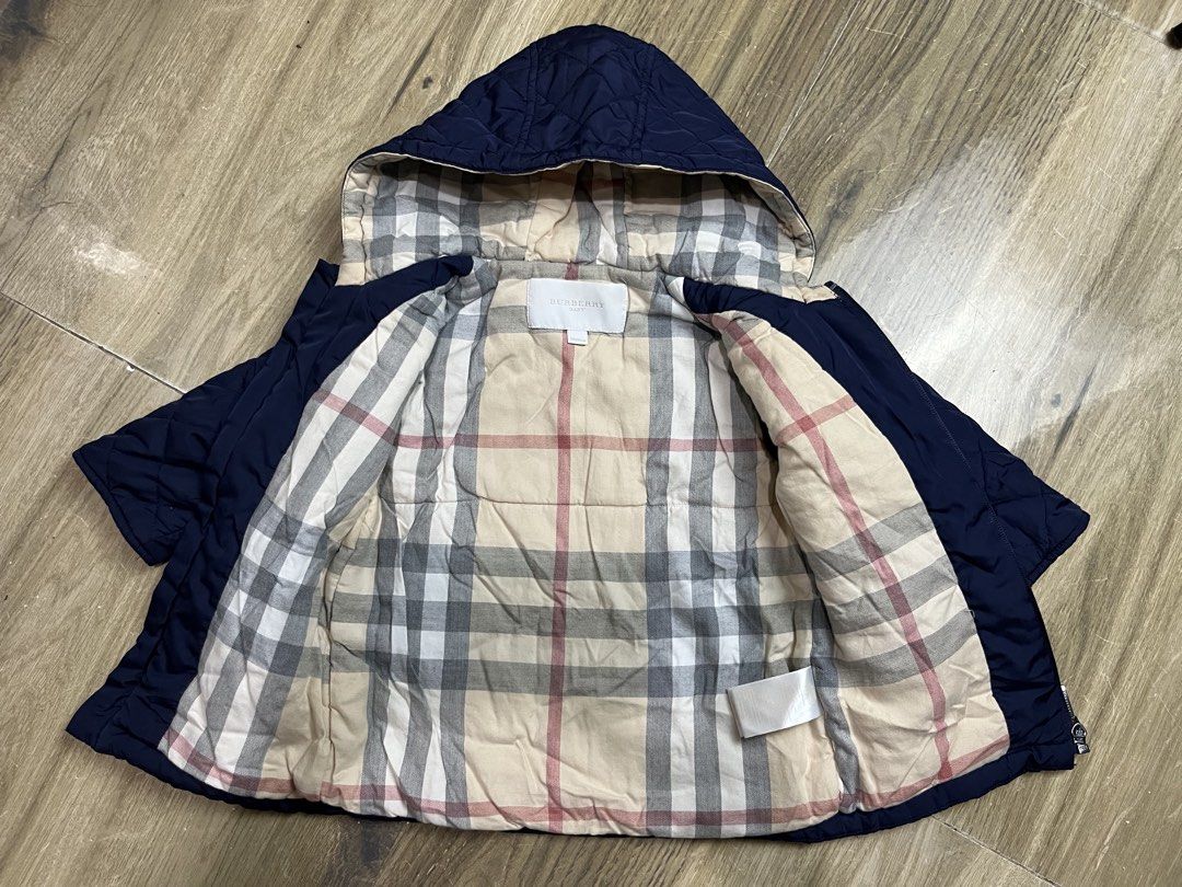BURBERY BABY Puffer Jacket (Category: Luxury Apparel) located in Bulacan. Submitted by letsfindukaywithme (Listing ID 1468066844, Image 3). Description: BURBERRY BABY Puffer Jacket 18m 1-2 yrs old 13x17" Sleeves: 13 Color: Navy Blue like new No issue +sf payment first Ship via J&T.