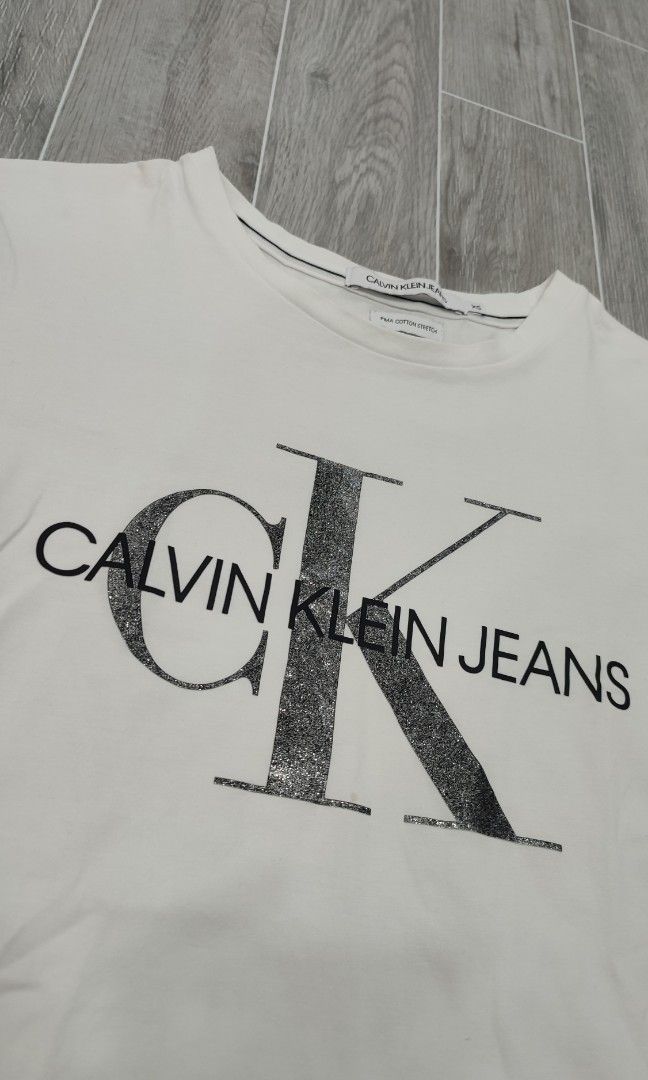 Calvin klein (Category: Shirts) located in Manila. Submitted by fhilbelensoncuenco09 (Listing ID 1468110881, Image 3). Description: CK ( XXL on tag ) Width: 16 Length: 23 Condition: Excellent Color Rate: 9.5/10 Issue: (Colors may vary due to lighting) Mine: 299 (automatically yours, add shipping fee if outside Surallah).