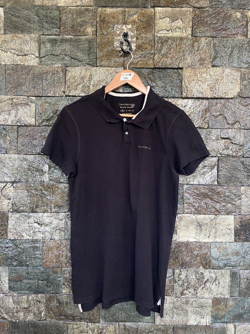 Calvin Klein Black Poloshirt (Category: Tshirts & Polo Shirts ) located in Cagayan de Oro. Submitted by curatedheirloomph_ (Listing ID 1468231864, Image 1). Description: 𝘿𝙞𝙢𝙚𝙣𝙨𝙞𝙤𝙣𝙨: 19x28 𝘽𝙚𝙨𝙩 𝙁𝙞𝙩: Medium - Large 𝘾𝙤𝙣𝙙𝙞𝙩𝙞𝙤𝙣 & 𝘾𝙤𝙡𝙤𝙧 𝙍𝙖𝙩𝙚: Excellent (9.5/10) 𝙄𝙨𝙨𝙪𝙚: Minimal lints 𝘼𝙪𝙩𝙝𝙚𝙣𝙩𝙞𝙘𝙞𝙩𝙮 𝘿𝙚𝙘𝙡𝙖𝙧𝙖𝙩𝙞𝙤𝙣: Authentic.