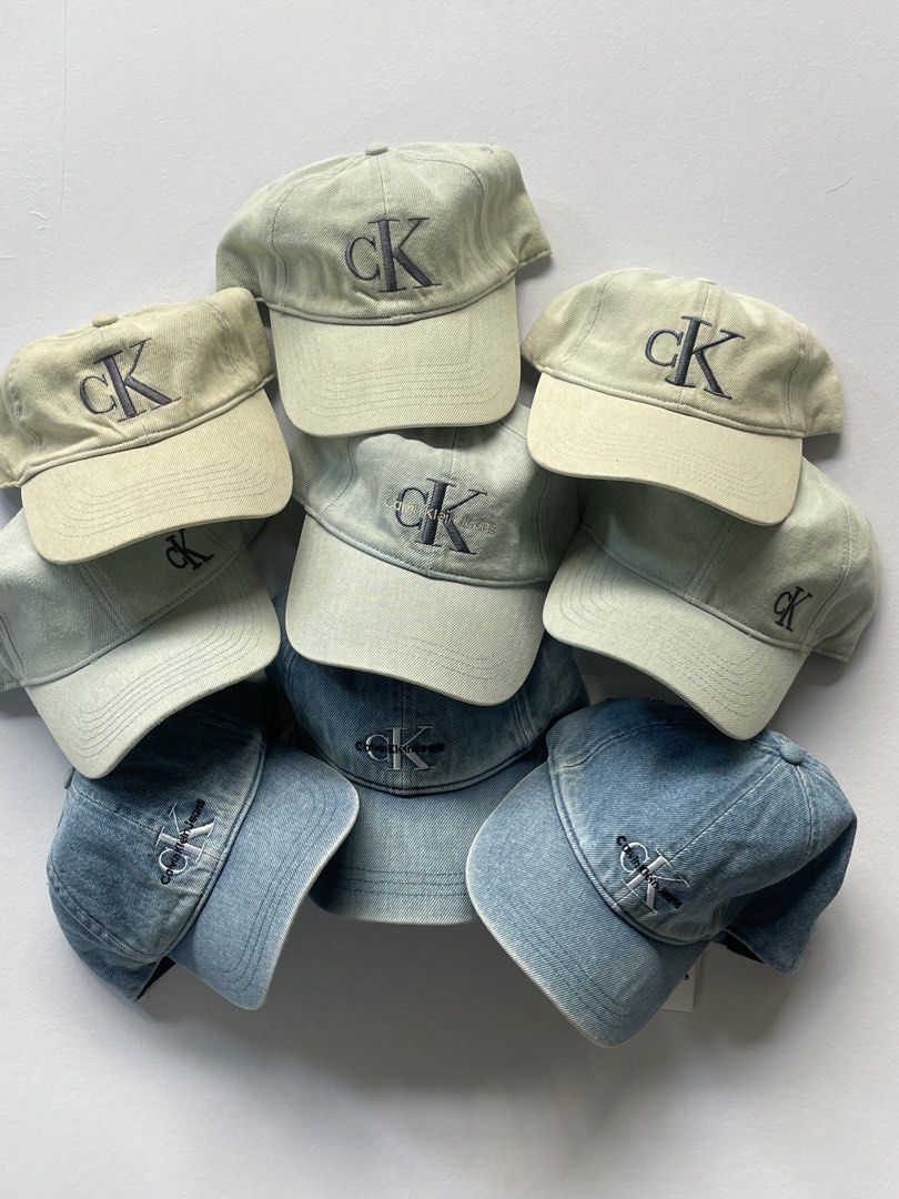 Calvin Klein Jeans Denim Baseball Caps Multiple Colors Available (Category: Caps & Hats) located in Manila. Submitted by sydge_ (Listing ID 1468138038, Image 1). Description: - Brand: Calvin Klein - Style: Classic dad hat with embroidered CK logo - Colors: Washed blue, light grey, and cream - Fit: Adjustable strap in the back for custom sizing - Condition: Brand new - 800 Pesos Each.