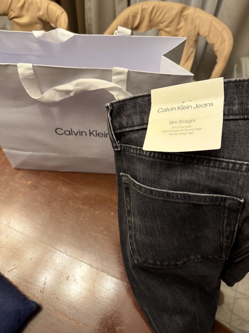 Calvin Klein Jeans Slim Straight Black Size 33x30 (Category: Jeans) located in Iloilo. Submitted by heco2k1999542 (Listing ID 1468067521, Image 1). Description: - Brand: Calvin Klein - Color: Black wash - Fit: Slim straight (sits at waist, fitted through hip/thigh, narrow leg) - Size: Tagged 33x30 - Condition: Bnew with tags and paper bag Orig price 12k Selling 4k - Inclusions: Original paper store tags and brand shopping bag.