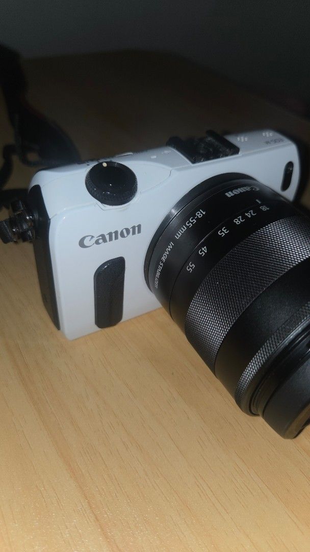 Canon EOS M Mirrorless Camera with 18-55mm Lens (Category: Cameras) located in Makati City. Submitted by ali_yvo (Listing ID 1468256644, Image 2). Description: Camera: Canon EOS M Mirrorless Body (White) - Lens: EF-M 18-55mm f/3.5-5.6 IS STM Zoom Lens - Condition: Clean body and glass, 100% working condition - Perfect compact setup for everyday shooting and travel Complete Package with: -Body, lens -Lens cover -Battery -Charger -Strap -Camera bag