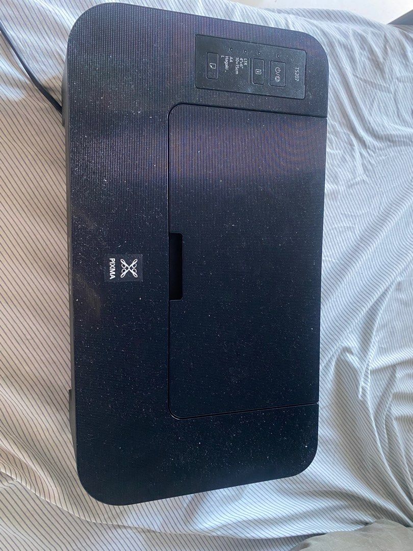 Canon PIXMA TS207 Inkjet Printer (Category: Printers, Scanners & Copiers) located in Quezon City. Submitted by padrinogg2 (Listing ID 1468107027, Image 3). Description: - Model: Canon PIXMA TS207 (Black) - Function: Compact single-function printer ideal for basic home use - Paper Handling: Supports sizes up to A4, 4x6, and L sizes via standard rear feed - Design: Simple control panel with power and resume buttons; space-saving footprint - Connect
