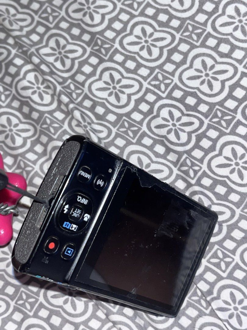 Canon PowerShot ELPH 360 HS Black Digital Camera with Box (Category: Cameras) located in Manila. Submitted by snti.go (Listing ID 1468114377, Image 3). Description: (flash doesnt work) Canon PowerShot ELPH 360 HS in black. Compact digital camera with 12x optical zoom and built-in Wi-Fi. Original box included in the sale. Rear screen shows heavy scratches and wear along the top edge. Fully functional unit overall. Great pocketable shooter for dail