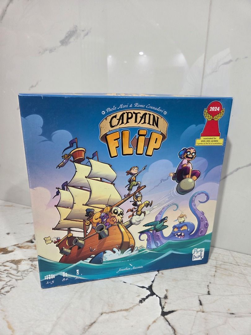 Captain Flip Board Game by Play Punk (Category: Board Games & Puzzles) located in Caloocan City. Submitted by caiwilmer (Listing ID 1468179069, Image 2). Description: Captain Flip — Family Board Game (Playagame / PlayMonster) Captain Flip by Paolo Mori & Remo Conzadori—the fast, fun press-your-luck pirate game nominated for the prestigious 2024 Spiel des Jahres! “Hoist your flag, recruit a crew, and fill your coffers with shiny gold coins! On you