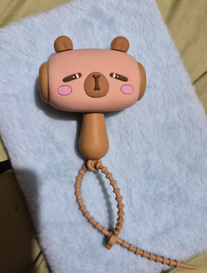 Capybara squeaky toy hammer with sound (Category: Kids Toys) located in Mandaue City. Submitted by chuchi152615 (Listing ID 1468138393, Image 1). Description: - with sounds Adorable brown bear character squeaky toy hammer (approx. 5 inches long) - Made of soft, high-quality silicone with cute pink cheeks and smiling eyes - Features a built-in beaded strap for convenient hanging or carrying - Produces a fun squeaking sound when pressed - Great as 