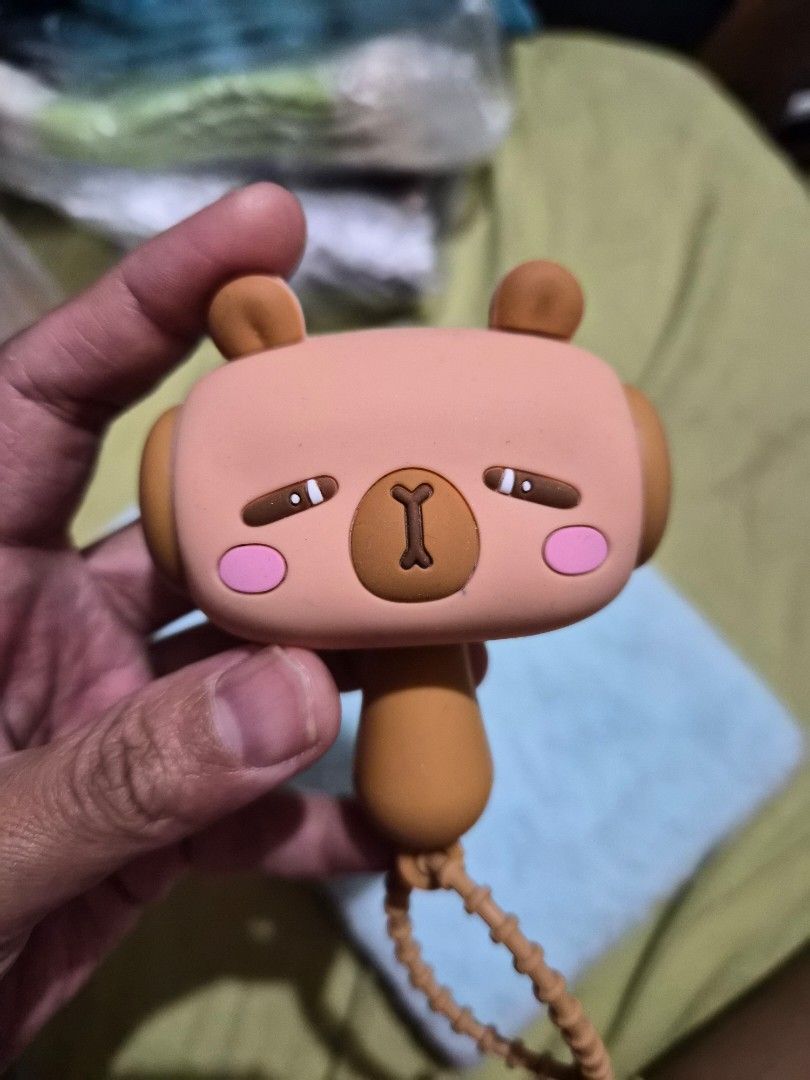 Capybara squeaky toy hammer with sound (Category: Kids Toys) located in Mandaue City. Submitted by chuchi152615 (Listing ID 1468138393, Image 2). Description: - with sounds Adorable brown bear character squeaky toy hammer (approx. 5 inches long) - Made of soft, high-quality silicone with cute pink cheeks and smiling eyes - Features a built-in beaded strap for convenient hanging or carrying - Produces a fun squeaking sound when pressed - Great as 