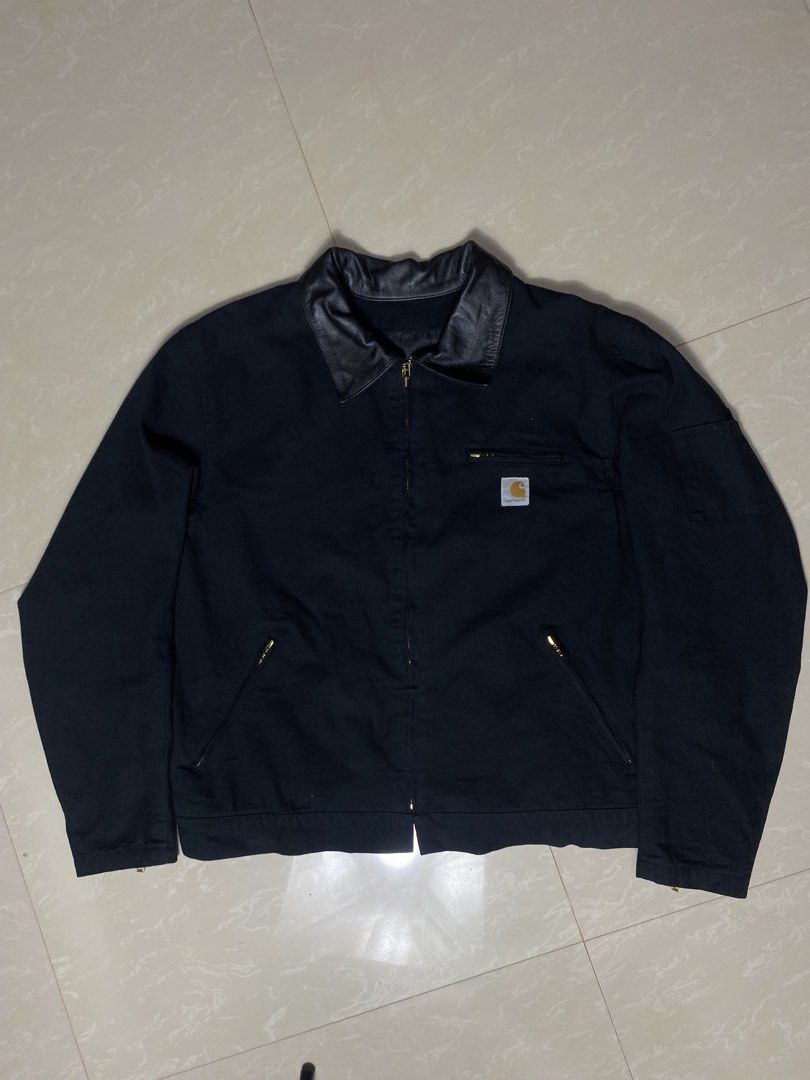 Carharrt Alternative (Category: Coats, Jackets and Outerwear) located in Muntinlupa City. Submitted by ajdomingo504210 (Listing ID 1468066594, Image 2). Description: - Brand: Spirit Gear - Size: XL - Material: Black canvas with contrasting black leather collar - Details: Carhartt logo patch on chest, zip closure - Pockets: Front zip pockets, left sleeve zip pocket, and interior pocket - Lining: Stylish striped inner lining -EXCELLENT CONDITION -N