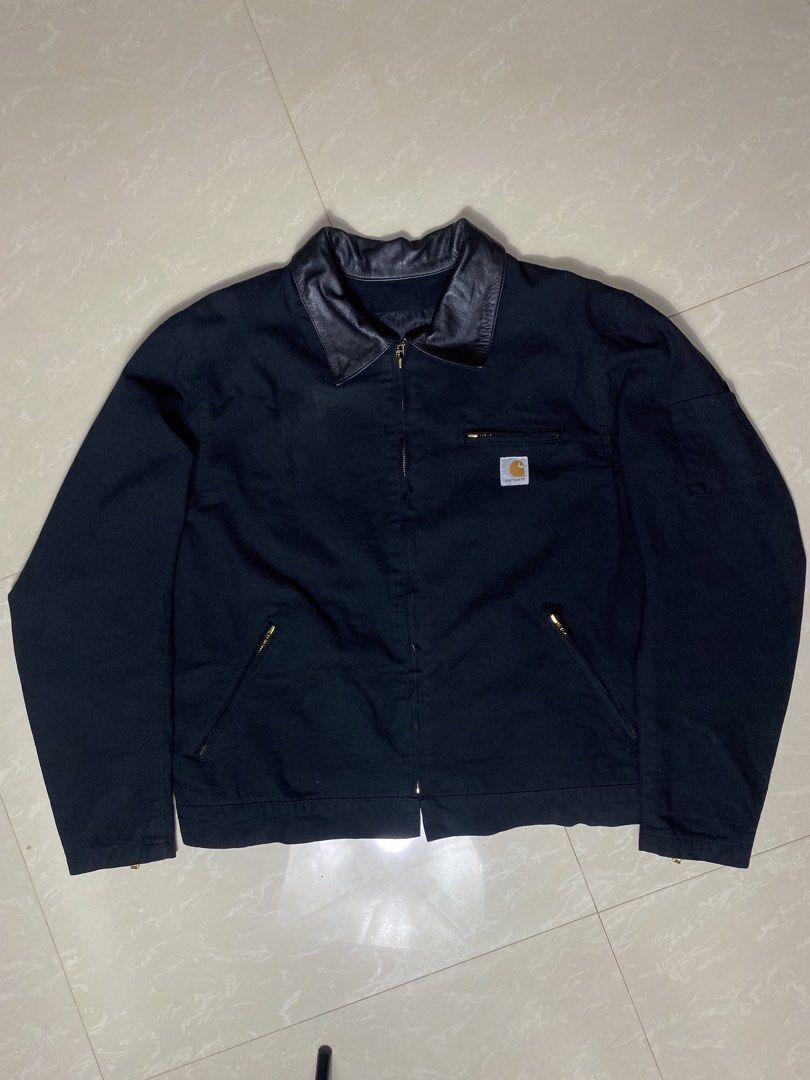 Carharrt Alternative (Category: Coats, Jackets and Outerwear) located in Muntinlupa City. Submitted by ajdomingo504210 (Listing ID 1468066594, Image 1). Description: - Brand: Spirit Gear - Size: XL - Material: Black canvas with contrasting black leather collar - Details: Carhartt logo patch on chest, zip closure - Pockets: Front zip pockets, left sleeve zip pocket, and interior pocket - Lining: Stylish striped inner lining -EXCELLENT CONDITION -N