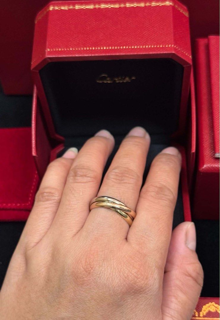Cartier Trinity Ring with Complete Box and Paper Bag (Category: Luxury Accessories) located in Cavite. Submitted by florabells (Listing ID 1468175534, Image 3). Description: - Brand: Cartier Trinity Ring - Material: Classic tri-color gold 18k - white, yellow & rose gold - Condition: Pristine, like new - Inclusions: Red presentation box, outer box, matching pouch, certificate booklet, and paper bag .